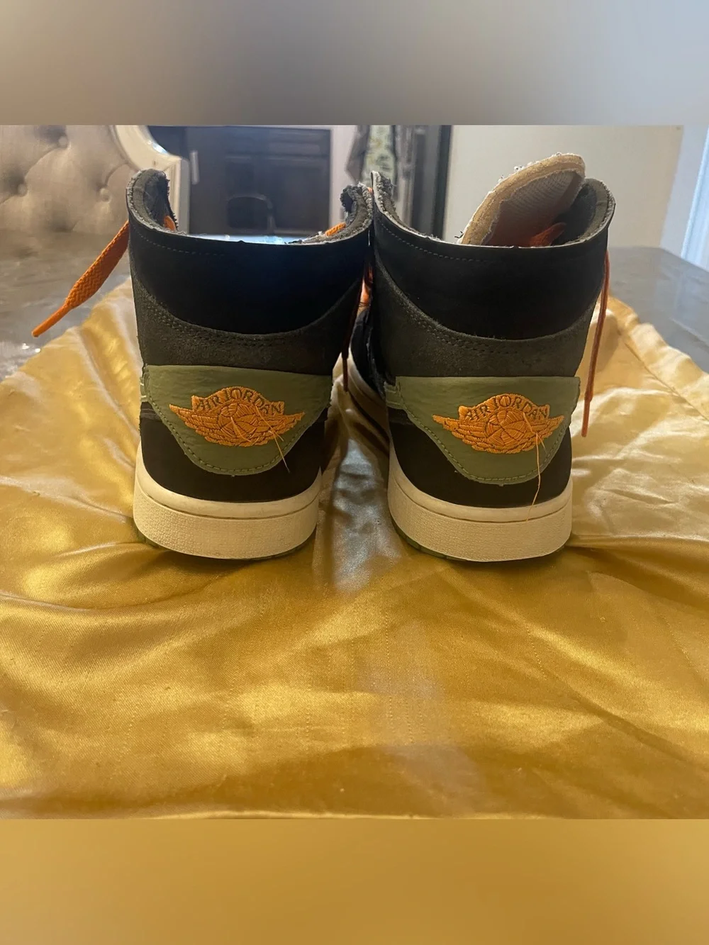 Nike Black High-Top Sneakers with Orange Laces and Green Swoosh